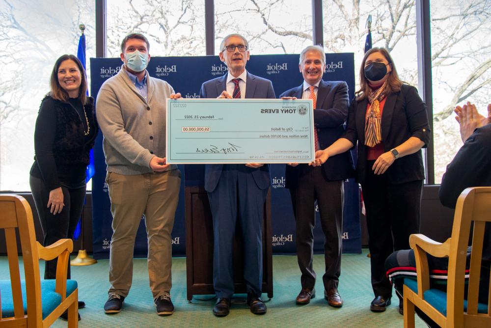 Gov. Tony Evers presents a check for $9 million to Beloit College and the City of Beloit. Shown f...