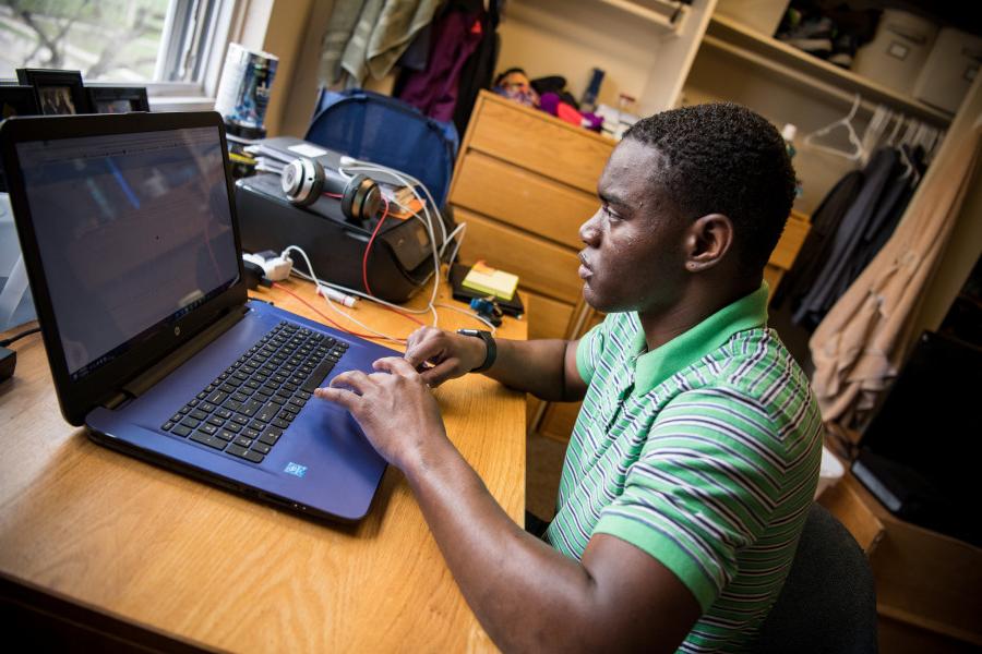 A Beloit student finds time to study in his dorm room.