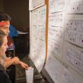 Students weigh their room options from floor plans posted in Pearsons Hall during the room lottery. Choices are ruled by a combination of...