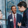 Saad Ahsan'21, Garrett Moore'20, and Beth Burnson'88 chat during Beloit's 2019 Econ Day in Chicago.